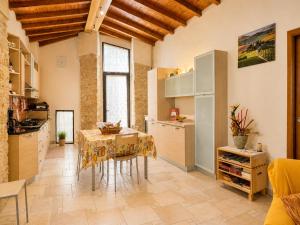 a kitchen with a table with a table cloth at Sant'Ippolito in Asciano
