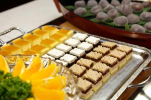a tray ofbrownies and other food on a table at Gora Hotel Paipuno Kemuri Plus in Hakone