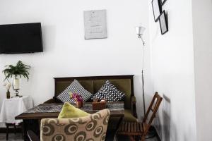 a dining room with a table and chairs at Aster 9 House in Bangkok