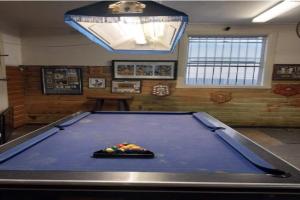 a pool table in a billiard room with at The Ashford Hotel and Restaurant in Ashford