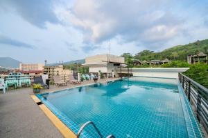 a swimming pool on the roof of a building at The Kris Resort Hotel in Patong Beach