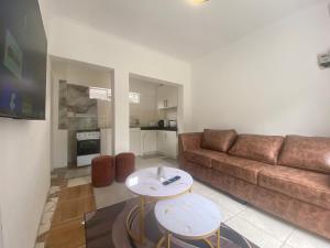 a living room with a couch and a table at Fiet Star in Midrand
