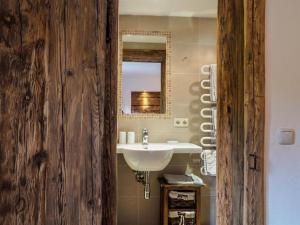 a bathroom with a sink and a mirror at Petererhof in Ellmau +59 photos