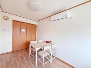 a dining room with a table and chairs at 晴の川 in Wakayama +8 photos