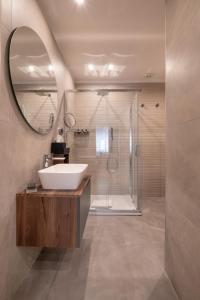 a bathroom with a sink and a shower at Giorgio Raggi Hospitality in Terni