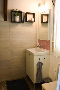 a bathroom with a sink and a mirror at Jó, hogy itt vagy! in Orfű +21 photos