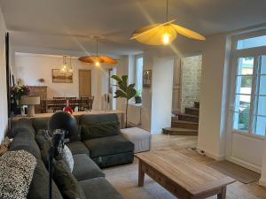 a living room with a couch and a table at Bienvenue au 24 in Le Havre