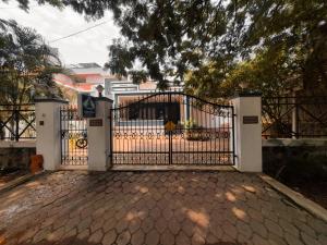 a gate in front of a house at Tamil Megam Villa in Chennai