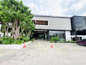 a parking lot in front of a building at The Gold Living Life in Thung Song