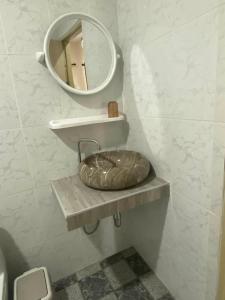 a bathroom with a sink and a mirror at The sun homestay01 in Ko Kood