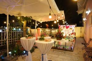 a white tent with tables with flowers and lights at Villa FLC Sầm Sơn SH20 in Sầm Sơn +22 photos