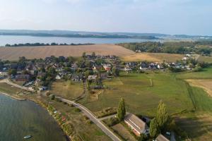 an aerial view of a small town next to a lake at Haus Inselperle mit Blick auf den Bodden in Alt Reddevitz +63 photos