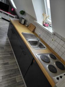 a kitchen with a sink and a counter top at Apartment in Stedesdorf