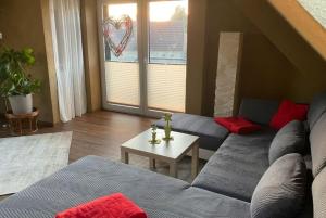 a living room with a couch and a table at Sonnenhof Krausnick in Krausnick