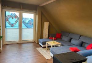a living room with a couch and a window at Sonnenhof Krausnick in Krausnick +18 photos