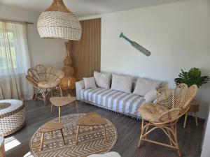 a living room with a couch and chairs at Casa Lumina in Lachapelle-sous-Rougemont