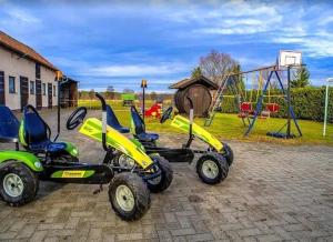 a group of four four wheelers parked next to a playground at Spreewald-Pension Marina in Lübben