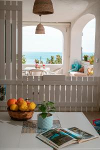 a basket of fruit on a table in a living room at Appartamenti Baia di Citara in Forio d'Ischia
