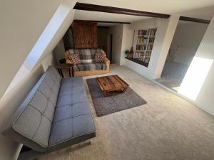 an overhead view of a living room with a couch and a table at Pohoda ve Starých Bukách in Staré Buky