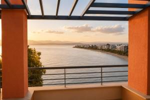 a view of the water from the balcony of a building at Alia Beachfront Penthouse with Sea View in Lefkandi Chalkidas