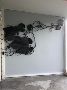 a white door with a black design on it at Truffle Ridge Vineyard Stay in Martinborough