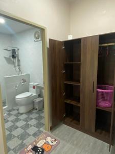 a bathroom with a toilet and a sink and a mirror at The Sun homestay03 in Ko Kut