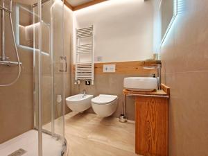 a bathroom with a toilet and a sink and a shower at Il Nido al Noce in Morgex +19 photos