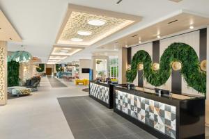 a lobby of a store with a row of counters at Danubius Hotel Annabella in Balatonfüred +36 photos