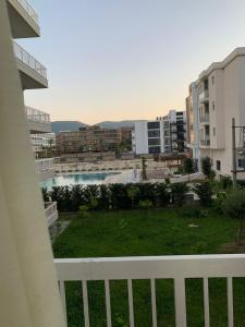 a view of a pool from a balcony of a building at Luna Mare Apartments in Orikum