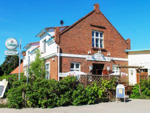 a brick building with a sign in front of it at Rankwitzer Hof in Rankwitz