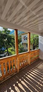 a balcony with a view of a mountain from a window at Budget Hostel in Mestia in Mestia