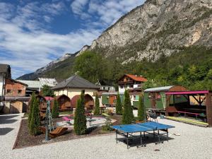 a playground with a table tennis court in front of a mountain at an der GEIERWAND in Haiming