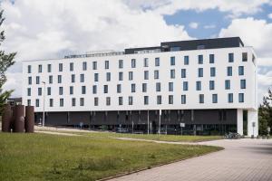 a white building with a lot of windows at EA Congress Hotel Aldis in Hradec Králové