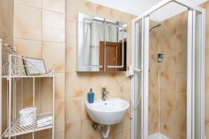 a bathroom with a sink and a shower at Hotel Por Santa Maria in Florence