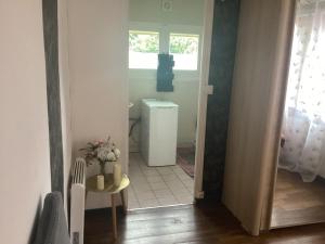 a small bathroom with a toilet and a window at Un petit truc en plus in Brienne-le-Château +31 photos