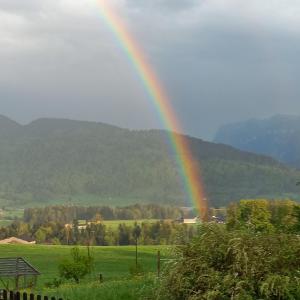 a rainbow in the middle of a field at Gästehaus Wiesenhof in Schwarzenberg