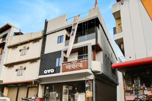 a building with a sign on the side of it at Hotel O by OYO Sawariya Regency in Bhopal