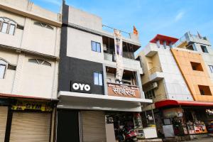 a building with an ovo sign on the side of it at Hotel O by OYO Sawariya Regency in Bhopal