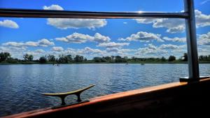 a view of a lake from the front of a boat at Bungalow THEA in Langhagen
