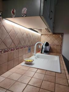 a kitchen counter with a sink and a mixer at A Casa da Vita in Chiaramonte Gulfi +81 photos