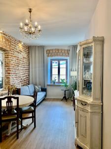 a living room with a couch and a table at Lublin Aura Residence in Lublin