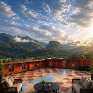 a patio with a view of mountains at Nangnon Hill Hug Hotel in Ban Pa Muat