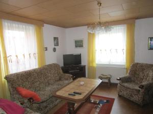 a living room with two couches and a coffee table at Ferienhaus 2 Bernd in Barth