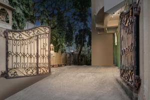 an entrance to a house with an iron gate at Collection O Andheri Near Western Express Highway in Mumbai