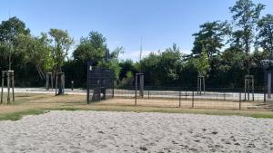 a park with a playground with a volley ball court at Tiny Haus C235 Wacholderdrossel in Groß Kordshagen