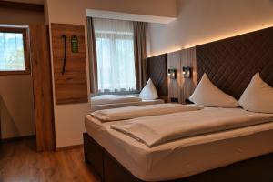 Llit o llits en una habitació de Hotel Charlotte