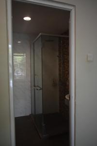 a shower with a glass door in a bathroom at D'Wharf Hotel PD Waterfront in Kampong Bangsal Kapor +30 photos