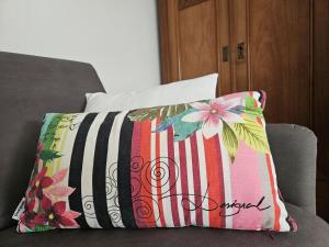 a pillow sitting on top of a couch at Ferienwohnung Wartturmblick in Nierstein +16 photos