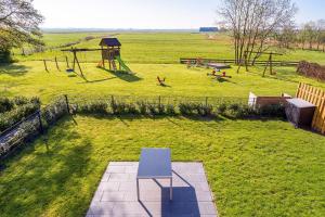 an aerial view of a park with a playground at Ferienwohnung Landleben am Meer in Bensersiel