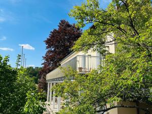 a white building with trees in front of it at GER-Haus in Waischenfeld